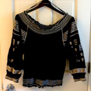 Size medium Free People black smocked blouse.